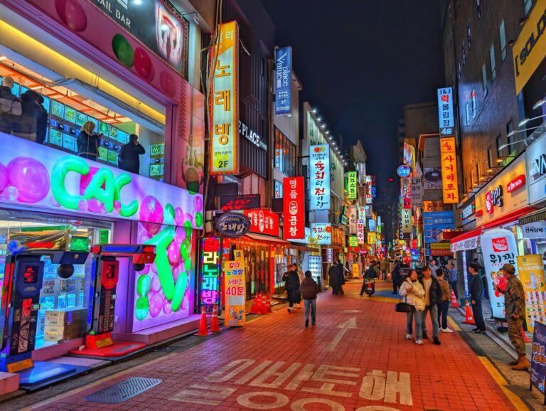 Abstract city street scene with colorful neon lights at night