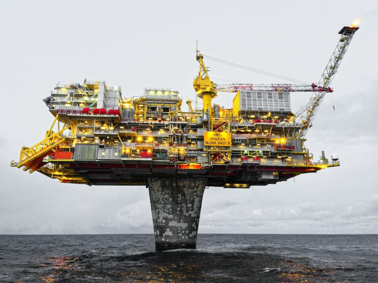 Offshore oil drilling platform in open ocean representing global energy markets