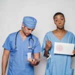 Medical professionals in scrubs reviewing patient information