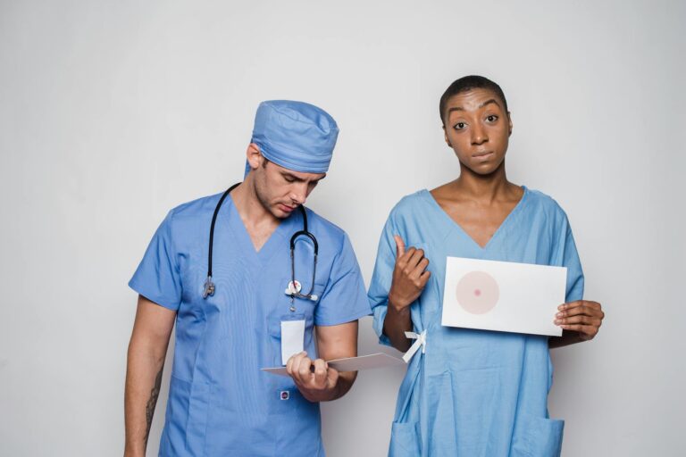 Medical professionals in scrubs reviewing patient information