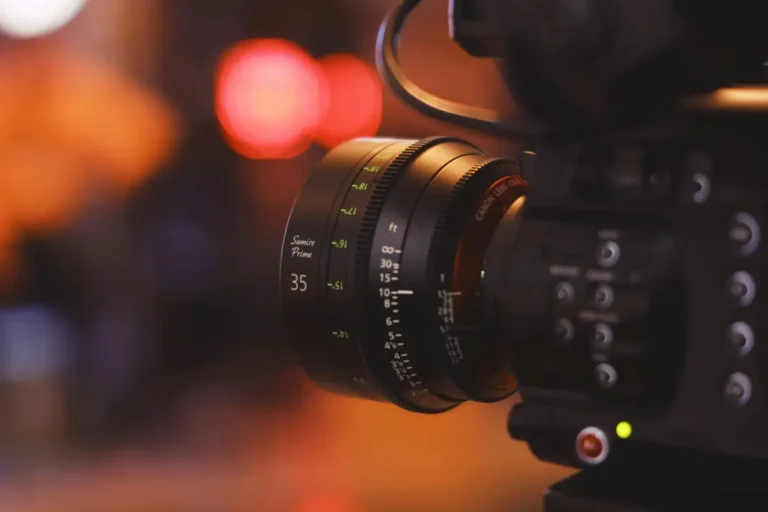 Close-up of a professional film camera lens representing AI-driven changes in film production costs