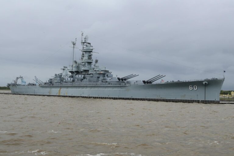 US Navy warship under overcast skies representing the military escalation of Operation Epic Fury against Iran