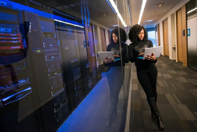 Business professional reviewing data infrastructure in a modern server room
